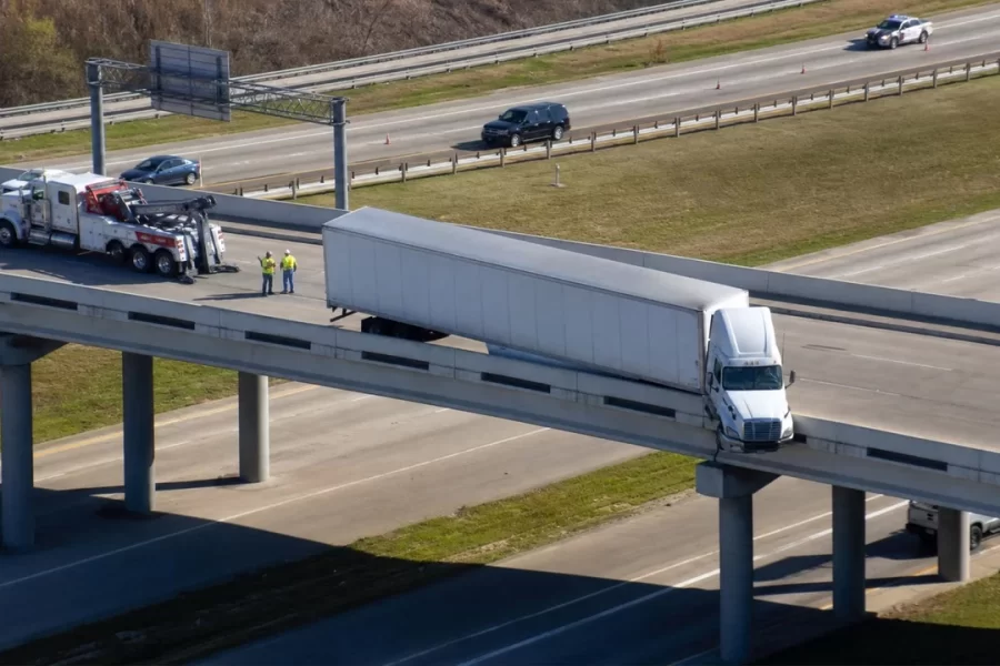 Two Injured After 18-Wheeler Hangs Over I-10 Overpass Near SH-99